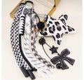 Llavero Estrella leopardo blanca